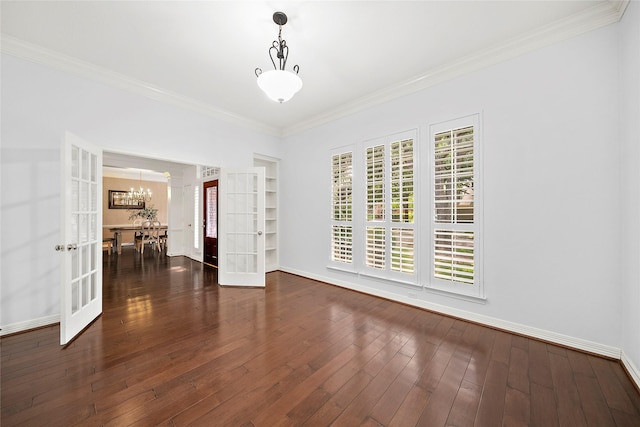 1930 Hollys Way, Sugar Land, TX 77479 - spare room with french doors, a chandelier, ornamental molding, wood finished floors, and baseboards