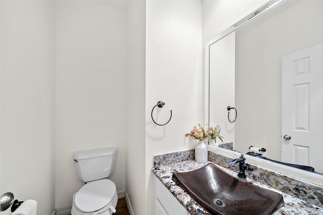 1930 Hollys Way, Sugar Land, TX 77479 - bathroom featuring toilet, vanity, and baseboards