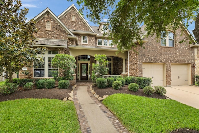 17311 Morgans Lake Dr, Cypress, TX 77433 - view of front of house with brick siding, concrete driveway, a garage, and a front yard