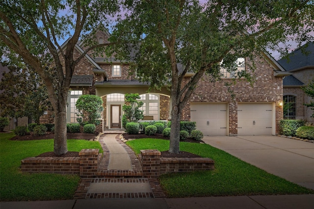 17311 Morgans Lake Dr, Cypress, TX 77433 - view of front of home with a garage, concrete driveway, and brick siding