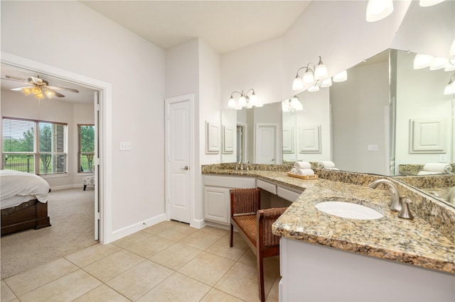 17311 Morgans Lake Dr, Cypress, TX 77433 - ensuite bathroom with vanity, ceiling fan, tile patterned floors, and baseboards