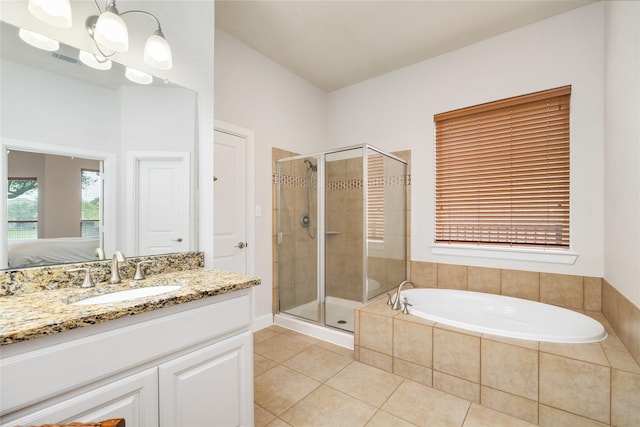 17311 Morgans Lake Dr, Cypress, TX 77433 - ensuite bathroom featuring tile patterned floors, a stall shower, a garden tub, and vanity