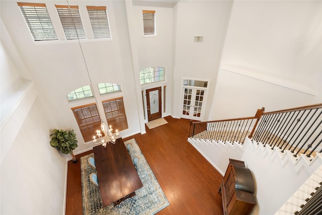17311 Morgans Lake Dr, Cypress, TX 77433 - entryway with a high ceiling, wood finished floors, a chandelier, baseboards, and french doors