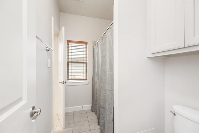 17311 Morgans Lake Dr, Cypress, TX 77433 - full bath featuring tile patterned floors, toilet, and baseboards