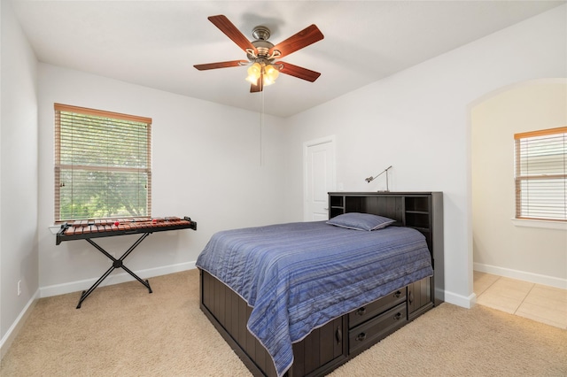 17311 Morgans Lake Dr, Cypress, TX 77433 - bedroom featuring multiple windows, light colored carpet, and baseboards