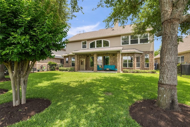 17311 Morgans Lake Dr, Cypress, TX 77433 - rear view of house featuring brick siding, a chimney, a patio, and an outdoor hangout area