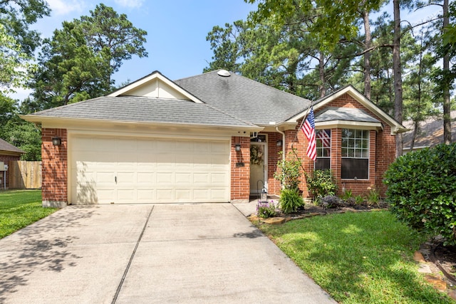 26 E Trillium Cir, The Woodlands, TX 77381 - ranch-style home with brick siding, a garage, concrete driveway, and a shingled roof