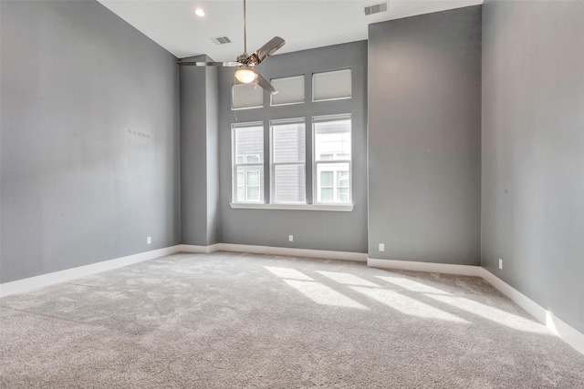 2620 Rusk St, Houston, TX 77003 - spare room with carpet, a ceiling fan, a towering ceiling, and baseboards