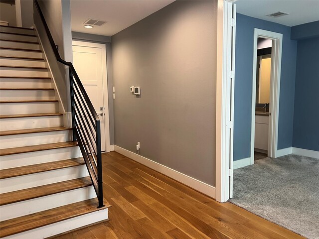 2620 Rusk St, Houston, TX 77003 - stairs with baseboards and wood finished floors