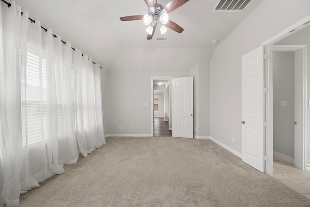 27130 Spanish Wind Ct, Magnolia, TX 77354 - unfurnished bedroom featuring multiple windows, light carpet, baseboards, and vaulted ceiling