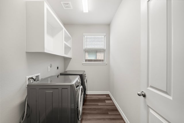 27130 Spanish Wind Ct, Magnolia, TX 77354 - laundry room featuring dark wood-type flooring, washer and clothes dryer, and baseboards