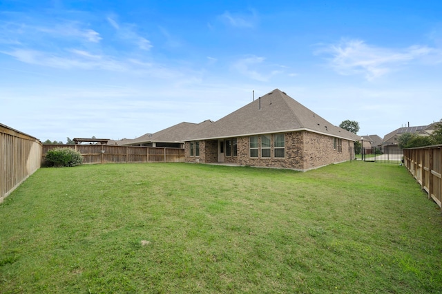 27130 Spanish Wind Ct, Magnolia, TX 77354 - rear view of house featuring brick siding and a shingled roof