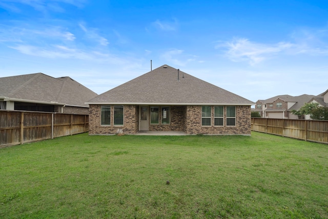 27130 Spanish Wind Ct, Magnolia, TX 77354 - rear view of house featuring brick siding, a patio, and a shingled roof