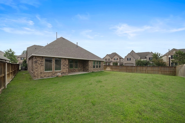 27130 Spanish Wind Ct, Magnolia, TX 77354 - back of house with brick siding and roof with shingles