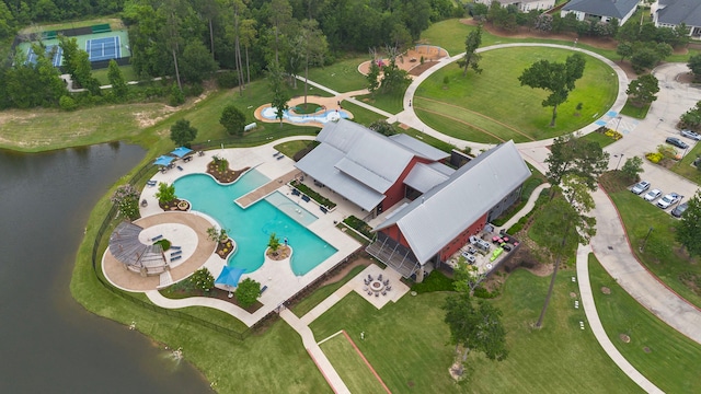 27130 Spanish Wind Ct, Magnolia, TX 77354 - aerial overview of property's location with a pool area and a nearby body of water