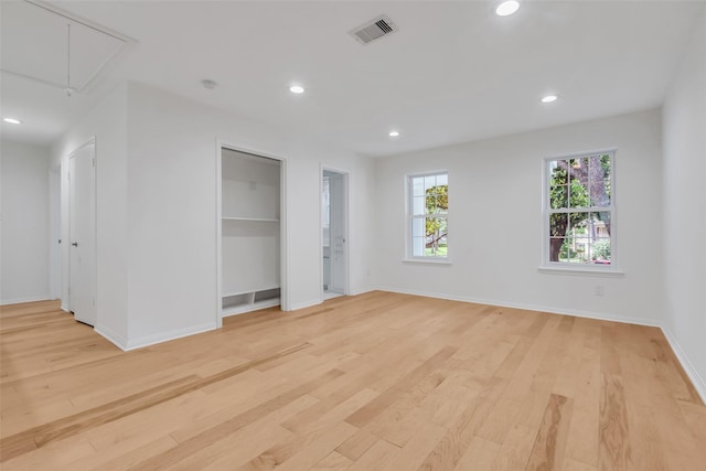 13631 Balmore Cir, Houston, TX 77069 - spare room featuring attic access, light wood-style flooring, baseboards, and recessed lighting