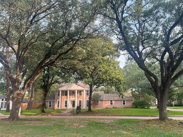 13631 Balmore Cir, Houston, TX 77069 - neoclassical home with brick siding and a front yard