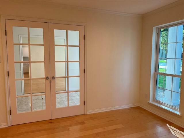 13631 Balmore Cir, Houston, TX 77069 - doorway featuring french doors, crown molding, light wood-style flooring, and baseboards
