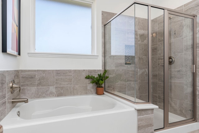 1304 Veranda Mist, League City, TX 77573 - full bathroom featuring a garden tub, a shower stall, and healthy amount of natural light
