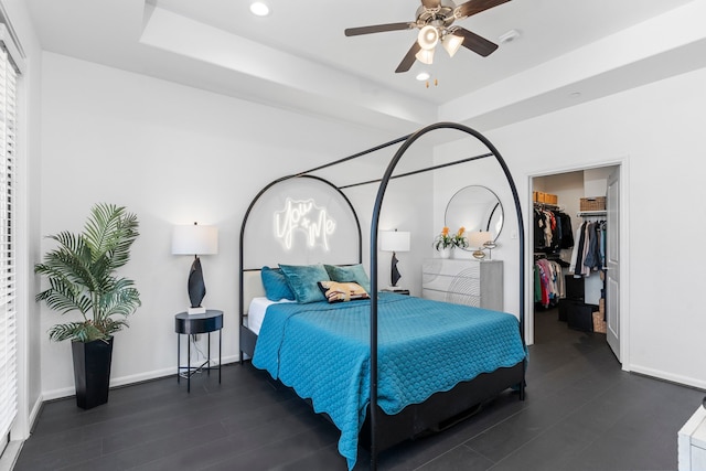 1304 Veranda Mist, League City, TX 77573 - bedroom with a walk in closet, baseboards, a raised ceiling, and recessed lighting