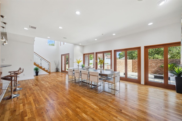 8003 Harbor Point Dr, Houston, TX 77071 - dining space with stairway, recessed lighting, light wood-type flooring, and baseboards