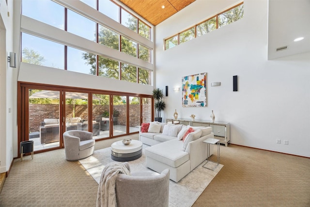 8003 Harbor Point Dr, Houston, TX 77071 - living room featuring a towering ceiling, healthy amount of natural light, carpet floors, baseboards, and recessed lighting