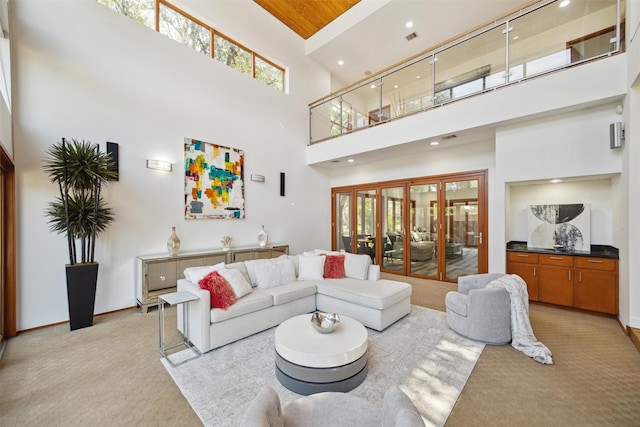 8003 Harbor Point Dr, Houston, TX 77071 - living room with a high ceiling, light carpet, baseboards, and recessed lighting