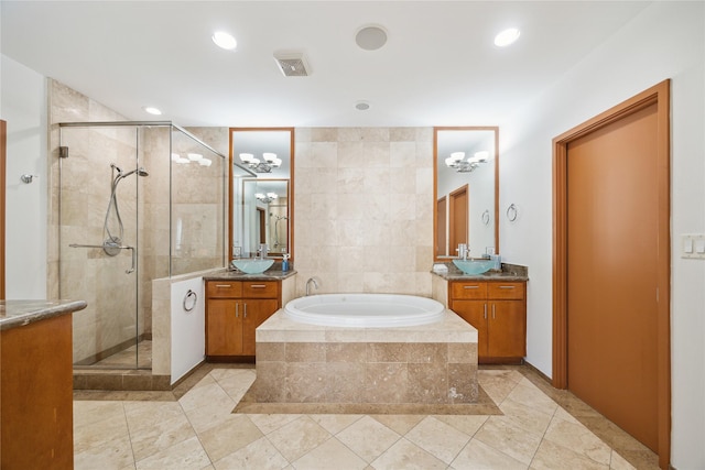 8003 Harbor Point Dr, Houston, TX 77071 - bathroom featuring a stall shower, a bath, two vanities, tile patterned flooring, and recessed lighting