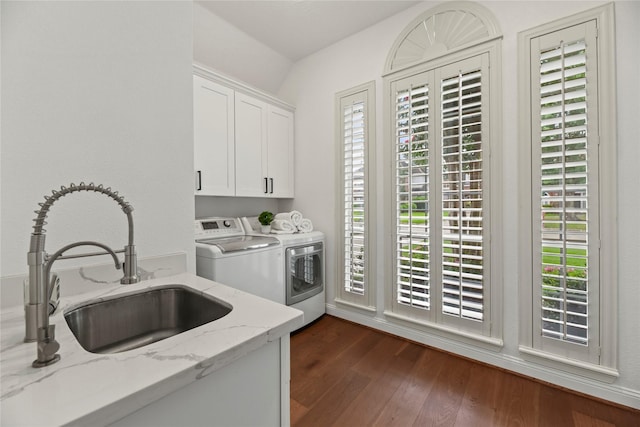 18818 Cypress Chateau Dr, Spring, TX 77388 - laundry area featuring cabinet space, independent washer and dryer, healthy amount of natural light, and dark wood-style floors