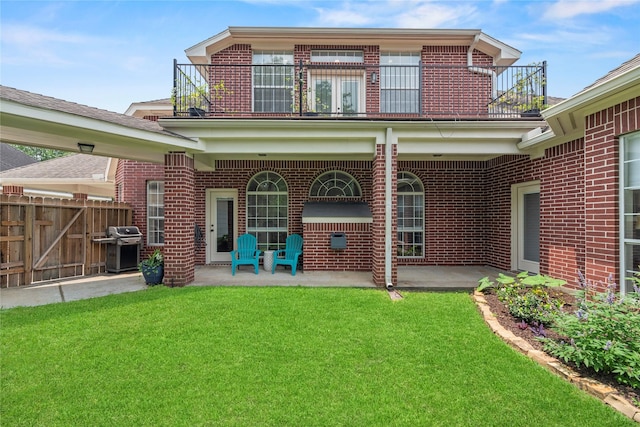 18818 Cypress Chateau Dr, Spring, TX 77388 - rear view of property with a balcony, brick siding, and a patio