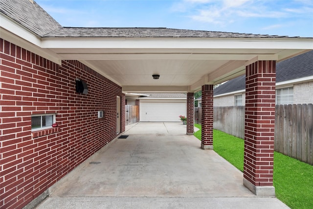 18818 Cypress Chateau Dr, Spring, TX 77388 - view of patio with driveway and an attached carport