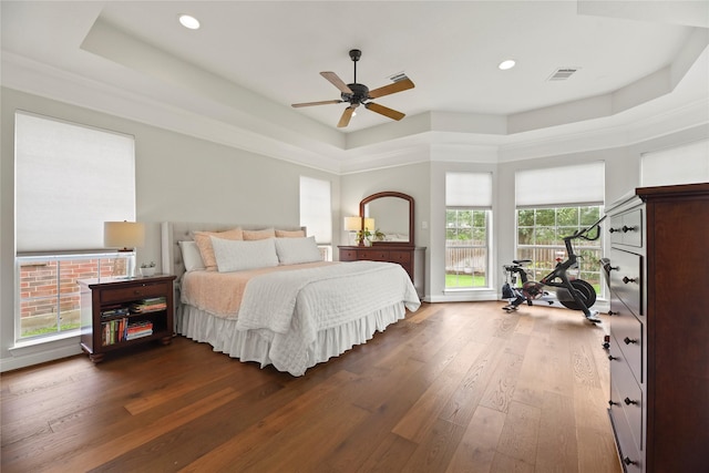 18818 Cypress Chateau Dr, Spring, TX 77388 - bedroom featuring a raised ceiling, dark wood-type flooring, recessed lighting, and a ceiling fan