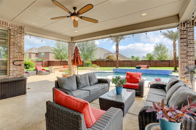 10727 Stone Isle Ct, Richmond, TX 77407 - fenced backyard featuring an outdoor living space, a ceiling fan, and a patio area