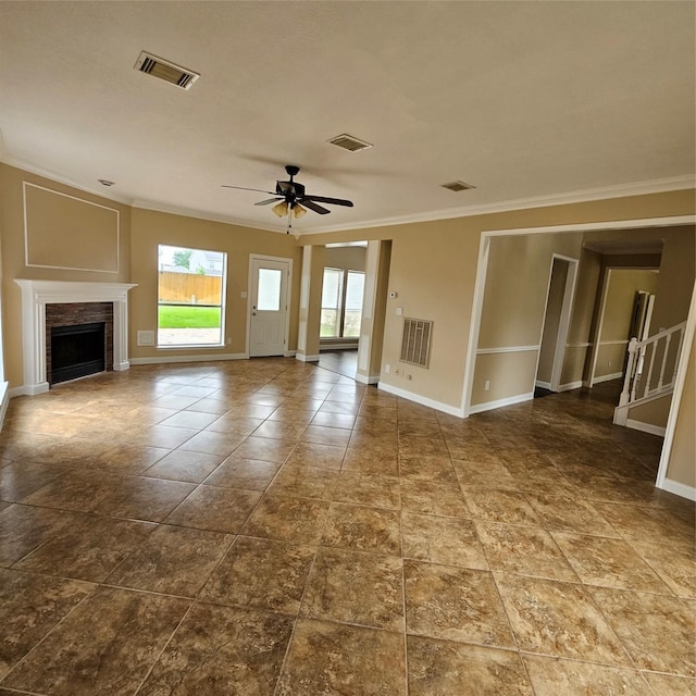 6118 Deep S Dr, Katy, TX 77449 - unfurnished living room with crown molding, ceiling fan, baseboards, and a fireplace