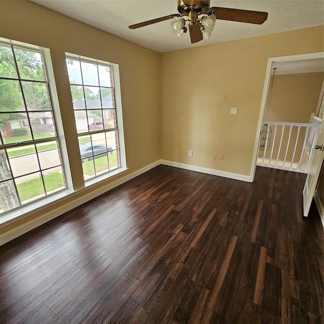 6118 Deep S Dr, Katy, TX 77449 - unfurnished room featuring dark wood-style flooring, ceiling fan, and baseboards