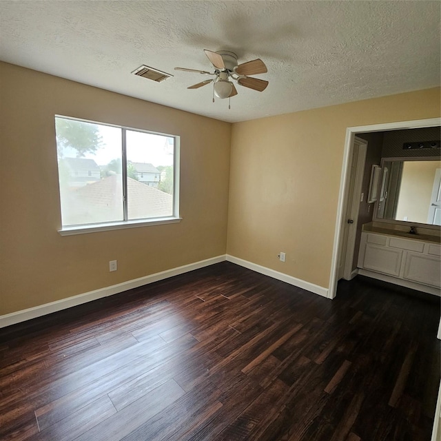 6118 Deep S Dr, Katy, TX 77449 - unfurnished room featuring a ceiling fan, dark wood-style floors, baseboards, and a textured ceiling