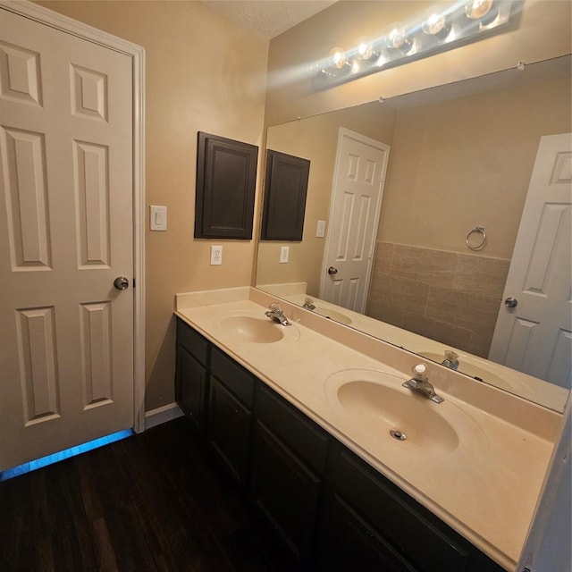 6118 Deep S Dr, Katy, TX 77449 - full bathroom featuring double vanity and wood finished floors