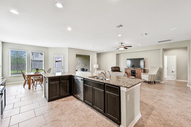 2708 Merlin Ln, Pearland, TX 77581 - kitchen featuring dishwasher, a sink, light tile patterned flooring, dark brown cabinets, and recessed lighting