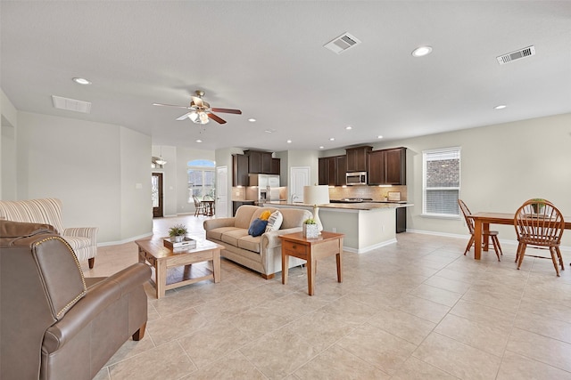 2708 Merlin Ln, Pearland, TX 77581 - living room featuring ceiling fan, recessed lighting, baseboards, and light tile patterned floors