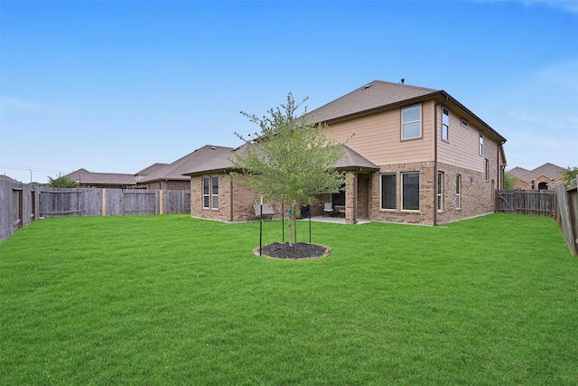 2708 Merlin Ln, Pearland, TX 77581 - back of property with brick siding and a patio area