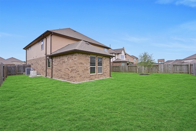 2708 Merlin Ln, Pearland, TX 77581 - rear view of house featuring brick siding and central AC