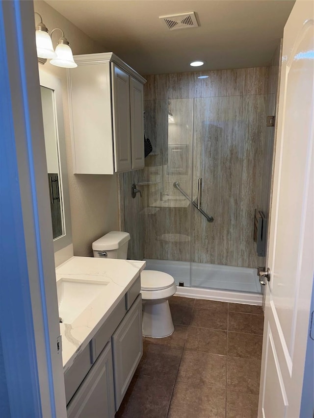 24811 Deep Coral Ct, Katy, TX 77494 - full bathroom with vanity, toilet, a stall shower, and tile patterned floors