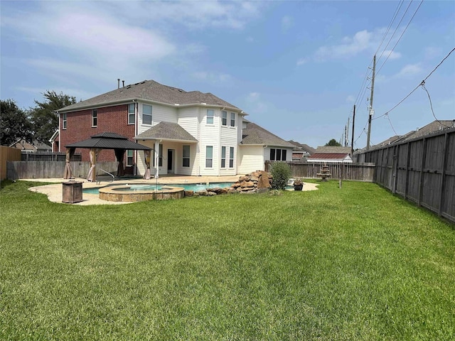 24811 Deep Coral Ct, Katy, TX 77494 - back of house featuring a gazebo and a pool with connected hot tub