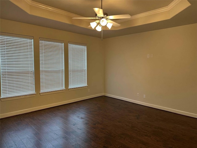 24811 Deep Coral Ct, Katy, TX 77494 - unfurnished room with a tray ceiling, crown molding, ceiling fan, dark wood-type flooring, and baseboards