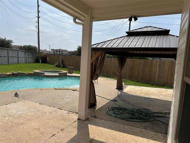 24811 Deep Coral Ct, Katy, TX 77494 - view of pool with a gazebo, a fenced backyard, a patio, and a pool with connected hot tub
