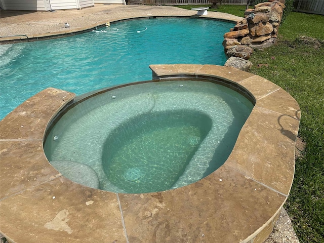24811 Deep Coral Ct, Katy, TX 77494 - view of pool with a pool with connected hot tub and a fenced backyard