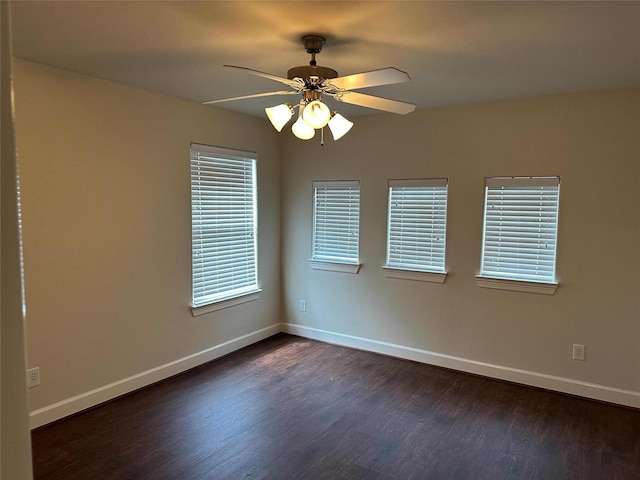 24811 Deep Coral Ct, Katy, TX 77494 - unfurnished room with dark wood finished floors, baseboards, and a ceiling fan