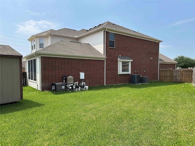 24811 Deep Coral Ct, Katy, TX 77494 - back of property with cooling unit, brick siding, and roof with shingles
