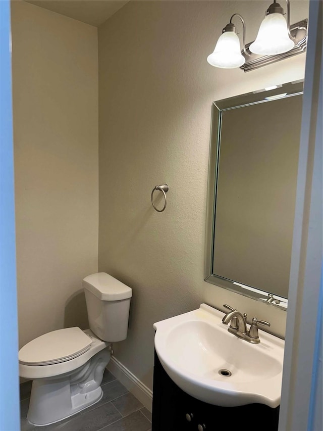 24811 Deep Coral Ct, Katy, TX 77494 - half bath featuring vanity, toilet, and baseboards
