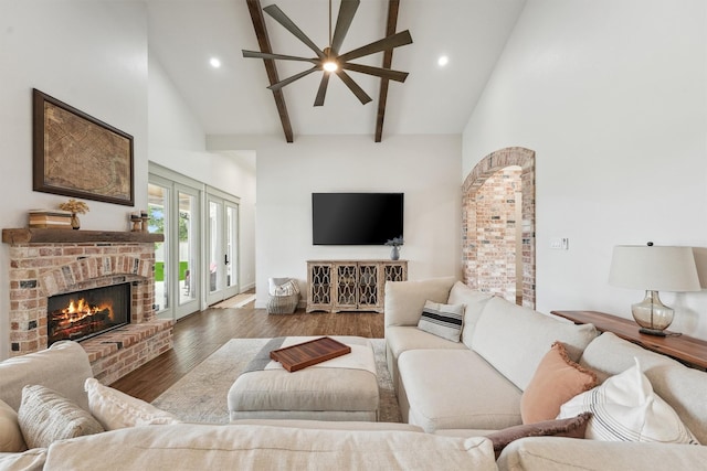 9343 Kai Dr, Beach City, TX 77523 - living room with a fireplace, beam ceiling, wood finished floors, high vaulted ceiling, and recessed lighting